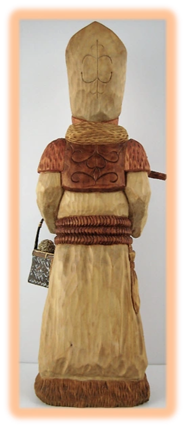 Father Christmas wood carving with staff and sack