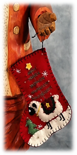 Slender Father Christmas carving with detailed face and hands