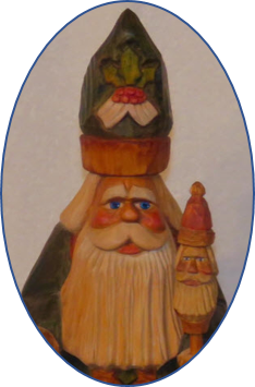 Father Christmas carving with tall slender figure and painted face