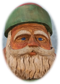 Carved Father Christmas portrait showing beard and painted facial details