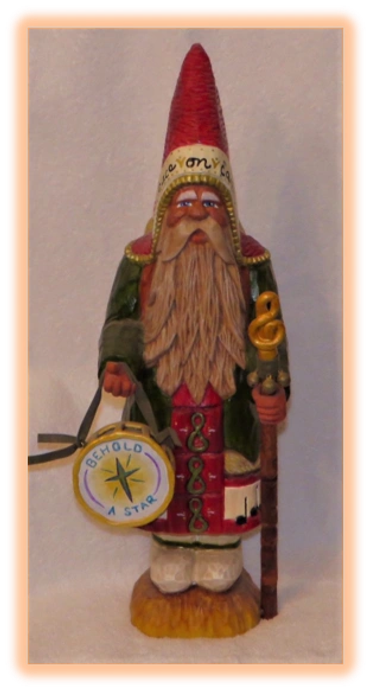Father Christmas carving in rich robes with detailed paintwork