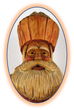 Father Christmas carving with added decorative objects