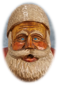 Carved Father Christmas face with white beard and rosy cheeks