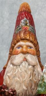 Close-up of a hand-carved Father Christmas face with painted features