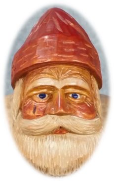 Father Christmas carving detail showing robe and face in warm tones